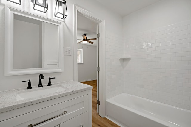 12816/12818 Pandora Dr, Dallas, TX 75238 - bathroom with wood finished floors, ceiling fan, vanity, and  shower combination