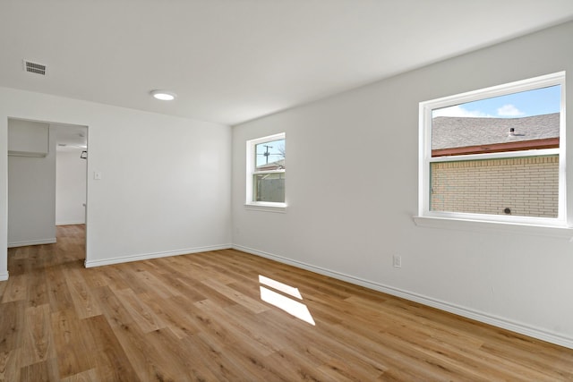 12816/12818 Pandora Dr, Dallas, TX 75238 - empty room featuring light wood-style flooring and baseboards