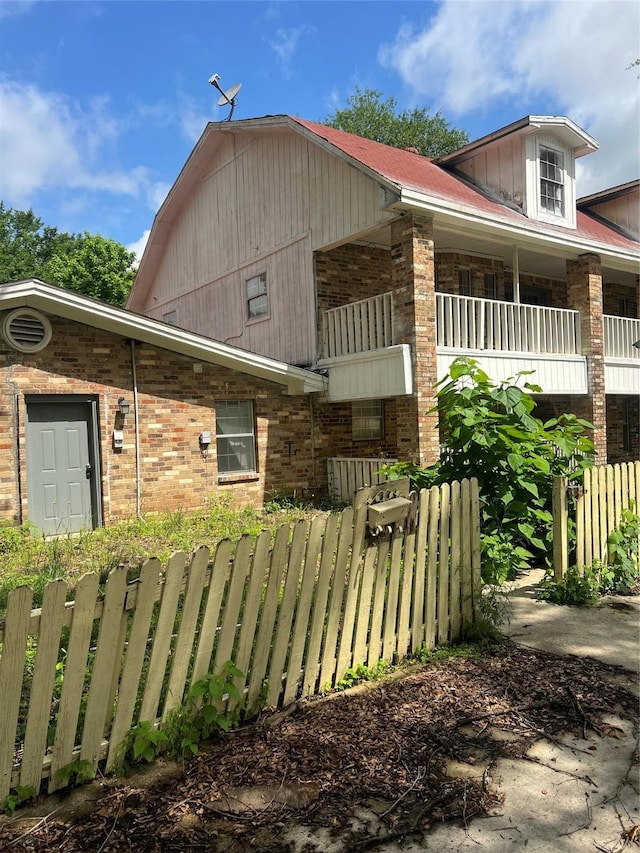 606 W Newton St Unit A, Terrell, TX 75160 - view of side of home featuring fence and brick siding