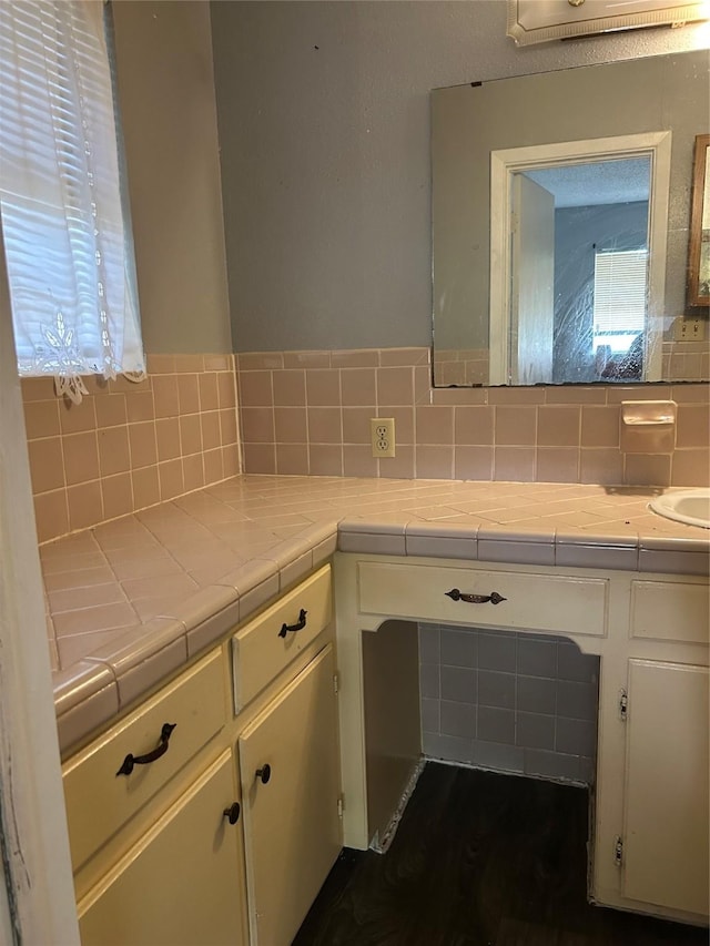 1024 W Chestnut St, Denison, TX 75020 - bathroom with decorative backsplash and vanity