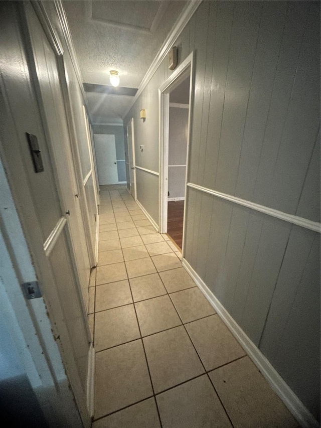 1024 W Chestnut St, Denison, TX 75020 - hall featuring crown molding, light tile patterned floors, and a textured ceiling