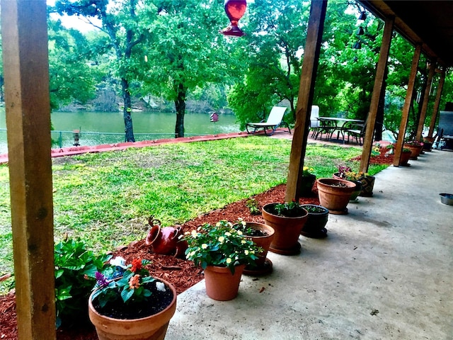 1026 County Road 1744, Chico, TX 76431 - view of green lawn with a patio and a water view
