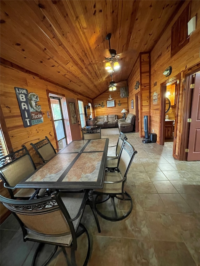 1026 County Road 1744, Chico, TX 76431 - dining space featuring wooden walls, vaulted ceiling, wood ceiling, and ceiling fan