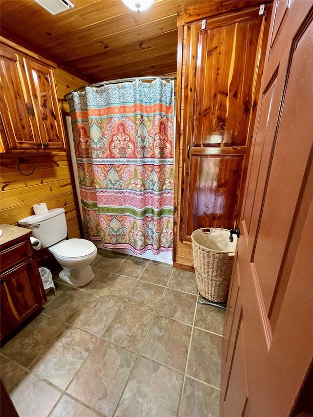 1026 County Road 1744, Chico, TX 76431 - bathroom with wood walls, toilet, wooden ceiling, curtained shower, and vanity