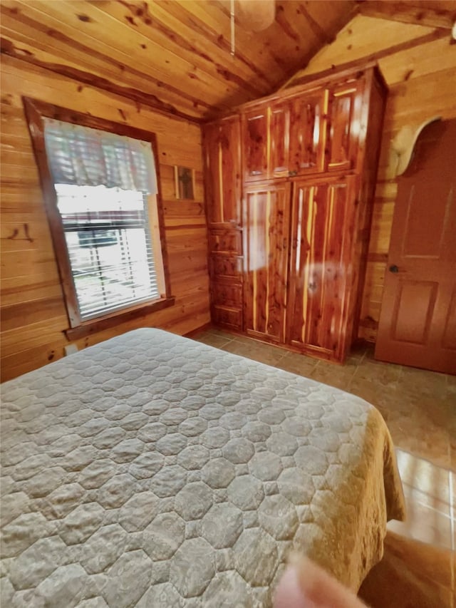 1026 County Road 1744, Chico, TX 76431 - bedroom with wooden walls and vaulted ceiling