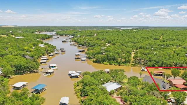 1026 County Road 1744, Chico, TX 76431 - aerial view of property and surrounding area with a large body of water, a heavily wooded area, and property boundaries highlighted