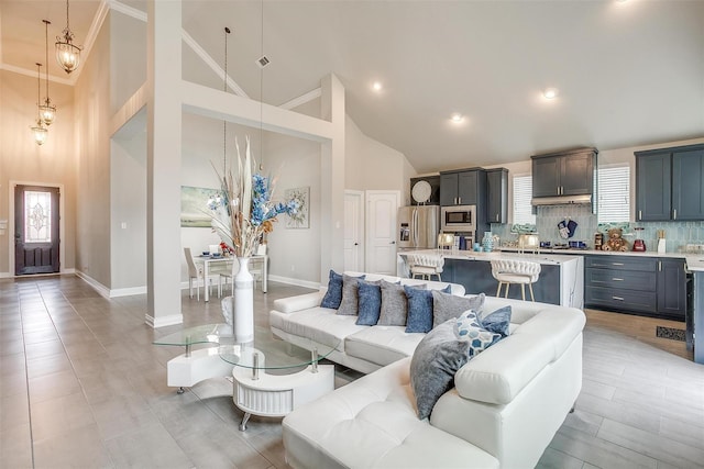 3015 Ruby Dr, Wylie, TX 75098 - living area featuring high vaulted ceiling, healthy amount of natural light, baseboards, and recessed lighting