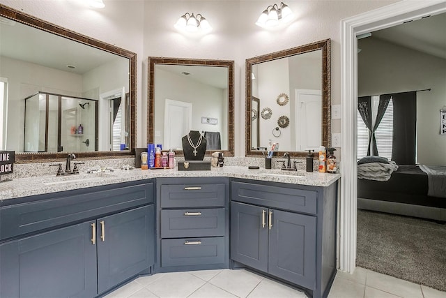 3015 Ruby Dr, Wylie, TX 75098 - ensuite bathroom featuring tile patterned floors, a shower stall, double vanity, and healthy amount of natural light