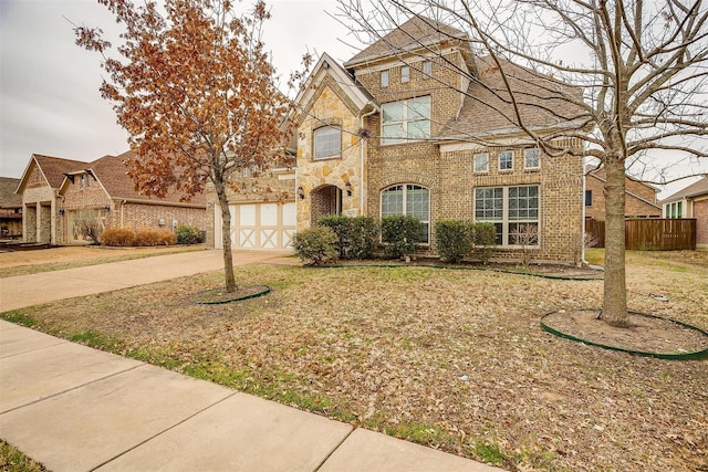 3015 Ruby Dr, Wylie, TX 75098 - view of front of home with concrete driveway, brick siding, and stone siding