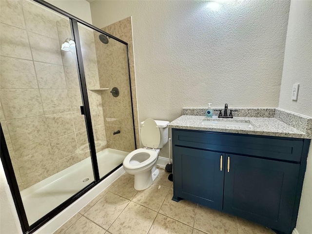 3015 Ruby Dr, Wylie, TX 75098 - full bathroom with a textured wall, a shower stall, toilet, tile patterned floors, and vanity