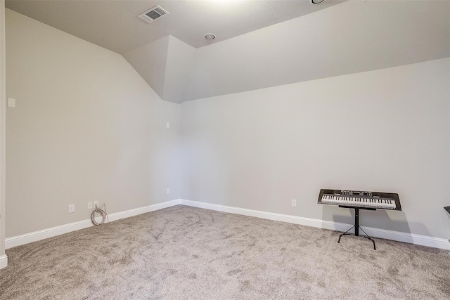 3015 Ruby Dr, Wylie, TX 75098 - carpeted empty room featuring vaulted ceiling and baseboards