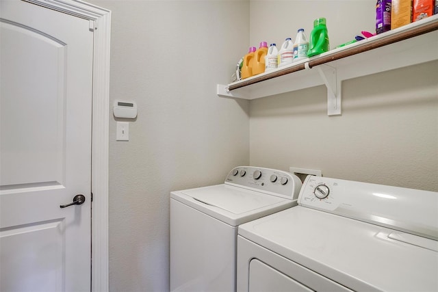 3015 Ruby Dr, Wylie, TX 75098 - laundry room featuring washer and dryer and a textured wall