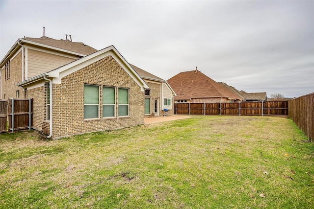 3015 Ruby Dr, Wylie, TX 75098 - back of house with brick siding and a patio