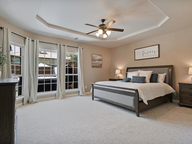 1505 Taylor Ln, Mckinney, TX 75071 - carpeted bedroom featuring a raised ceiling, baseboards, and a ceiling fan