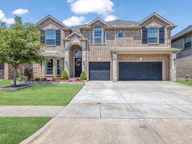 1505 Taylor Ln, Mckinney, TX 75071 - view of front of property featuring driveway, a garage, a front lawn, and brick siding