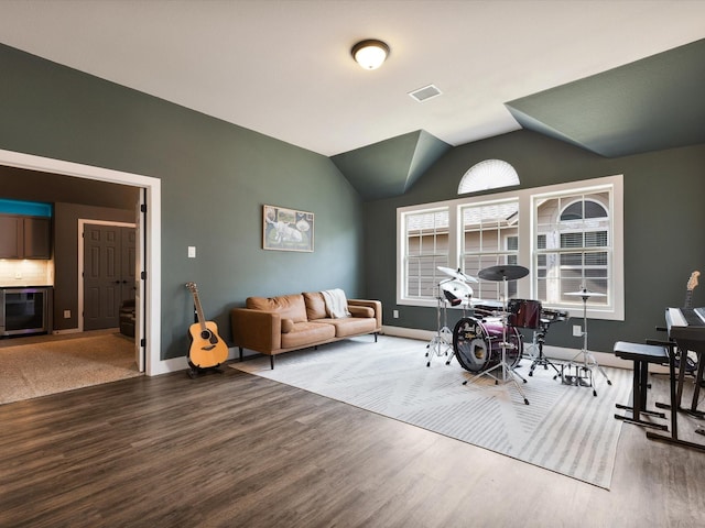 1505 Taylor Ln, Mckinney, TX 75071 - living room featuring wood finished floors, baseboards, and lofted ceiling