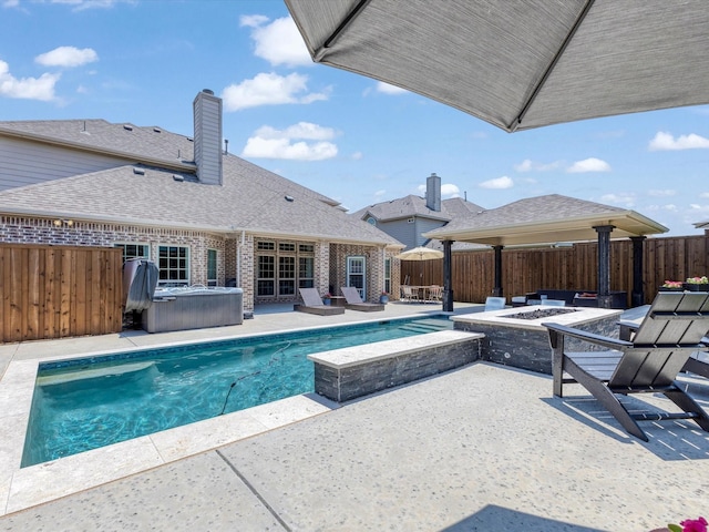 1505 Taylor Ln, Mckinney, TX 75071 - view of swimming pool featuring a hot tub, an outdoor fire pit, a patio area, and a fenced backyard