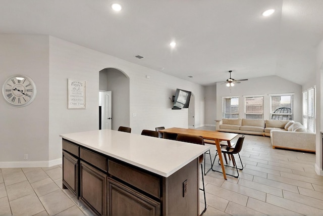 3817 Myrtle Way, Kaufman, TX 75142 - kitchen featuring ceiling fan, arched walkways, light tile patterned floors, light countertops, and recessed lighting