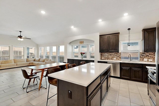 3817 Myrtle Way, Kaufman, TX 75142 - kitchen with stainless steel appliances, a sink, decorative backsplash, ceiling fan, and light countertops