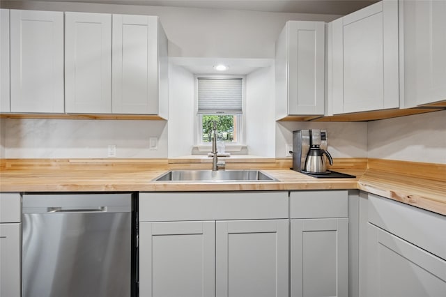 563 Country Club Rd, Bowie, TX 76230 - kitchen featuring stainless steel dishwasher, butcher block countertops, a sink, and recessed lighting