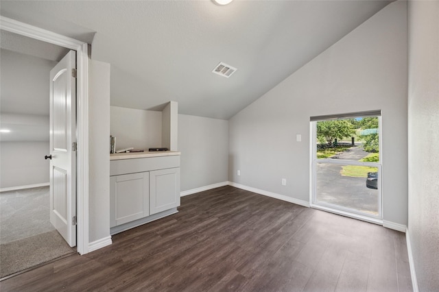 563 Country Club Rd, Bowie, TX 76230 - bonus room featuring lofted ceiling, dark wood-style floors, and baseboards