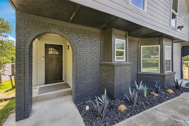 563 Country Club Rd, Bowie, TX 76230 - doorway to property featuring brick siding