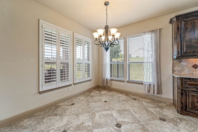 10601 San Simeon Ln, Fort Worth, TX 76179 - unfurnished dining area featuring a chandelier, baseboards, and light tile patterned floors