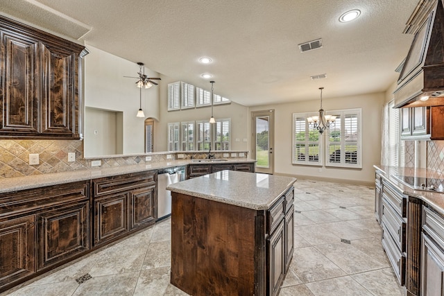 10601 San Simeon Ln, Fort Worth, TX 76179 - kitchen with dishwasher, backsplash, custom range hood, a chandelier, and dark brown cabinets