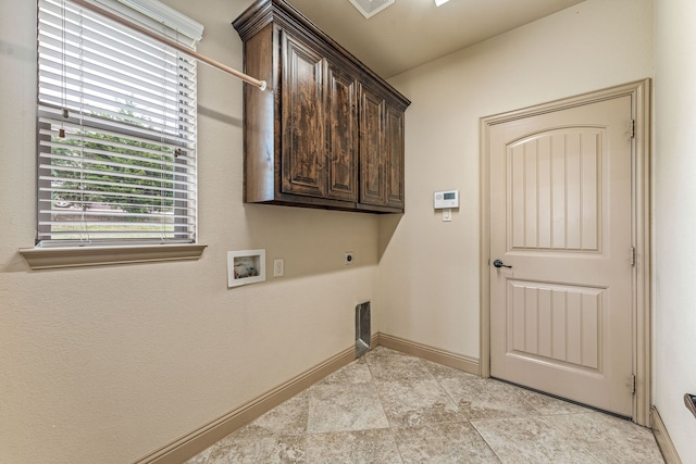 10601 San Simeon Ln, Fort Worth, TX 76179 - laundry room featuring hookup for an electric dryer, cabinet space, hookup for a washing machine, and baseboards