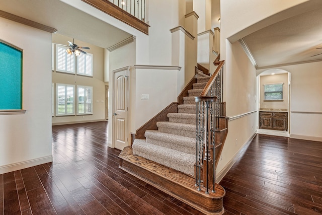 10601 San Simeon Ln, Fort Worth, TX 76179 - stairway featuring a ceiling fan, hardwood / wood-style floors, a high ceiling, crown molding, and baseboards