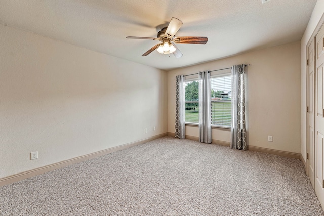 10601 San Simeon Ln, Fort Worth, TX 76179 - unfurnished room with a ceiling fan, light carpet, baseboards, and a textured ceiling