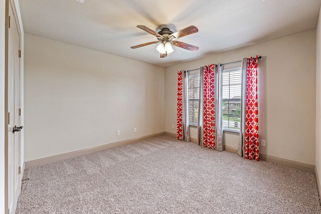 10601 San Simeon Ln, Fort Worth, TX 76179 - empty room featuring light colored carpet, a ceiling fan, baseboards, and a textured ceiling