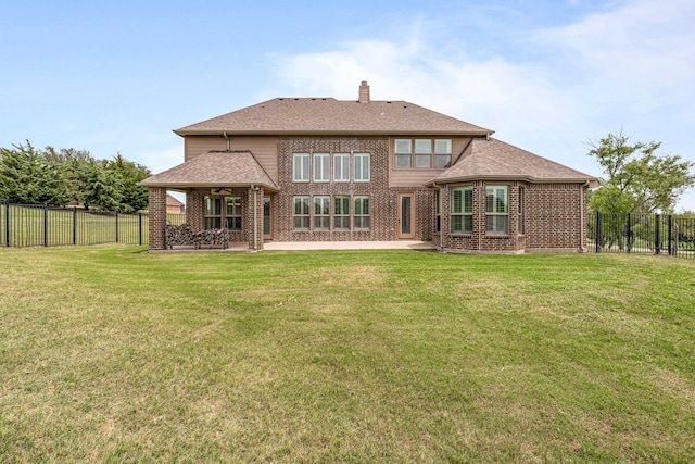 10601 San Simeon Ln, Fort Worth, TX 76179 - rear view of property featuring brick siding, a chimney, a patio area, a ceiling fan, and roof with shingles