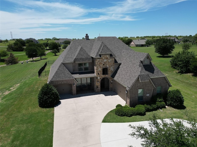 10601 San Simeon Ln, Fort Worth, TX 76179 - french country home with brick siding, roof with shingles, a front yard, and driveway
