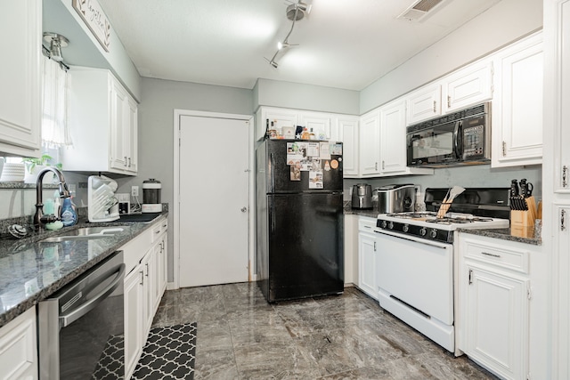 1315 Crestview Dr, Kaufman, TX 75142 - kitchen with black appliances, a sink, white cabinetry, and dark stone counters