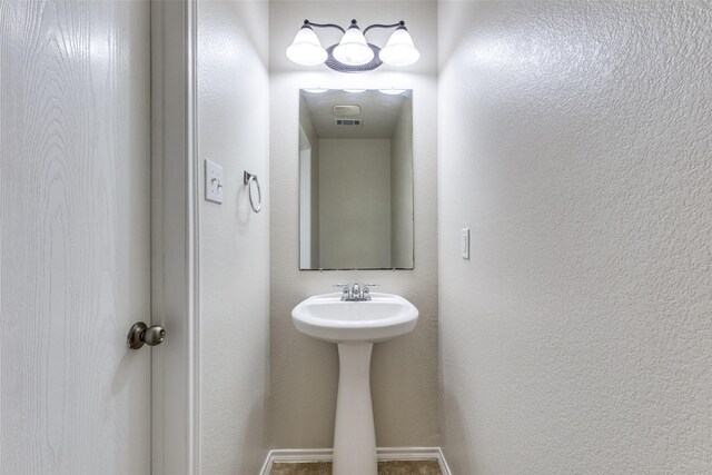 2101 Laughlin Rd, Fort Worth, TX 76177 - bathroom with baseboards and a sink
