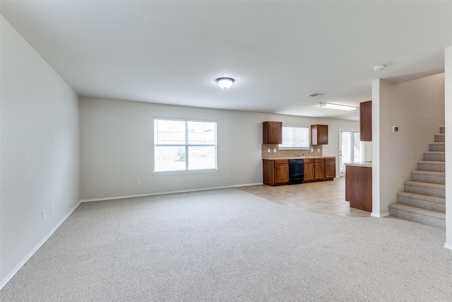 2101 Laughlin Rd, Fort Worth, TX 76177 - unfurnished living room featuring light colored carpet, stairs, and baseboards