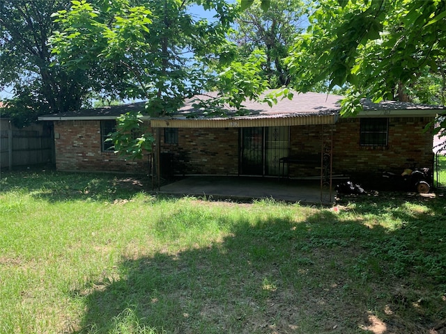 1317 W Bruton Rd, Mesquite, TX 75149 - back of property with brick siding and a patio area