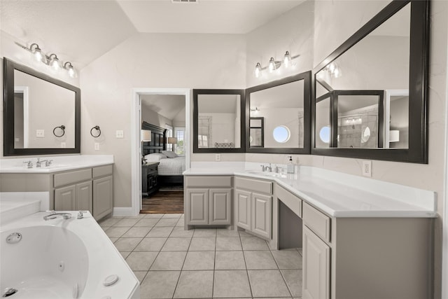 1009 Maida Vale, Haslet, TX 76052 - bathroom with lofted ceiling, vanity, a whirlpool tub, ensuite bath, and tile patterned floors