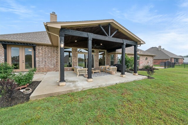 1009 Maida Vale, Haslet, TX 76052 - back of house featuring brick siding, an outdoor living space, french doors, a chimney, and a patio