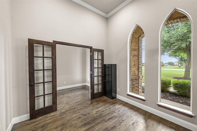 1009 Maida Vale, Haslet, TX 76052 - unfurnished room with french doors, ornamental molding, dark wood-type flooring, and baseboards