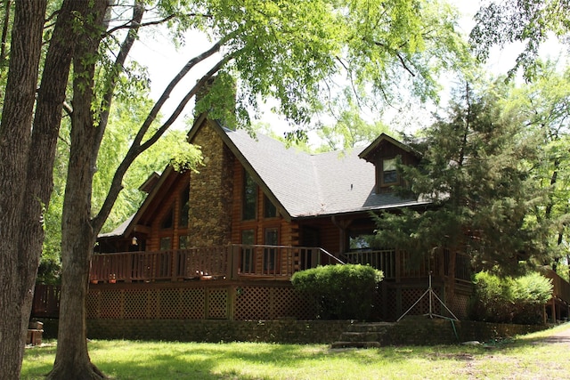 1147 Rs County Road 3503, Emory, TX 75440 - rear view of property featuring log siding, roof with shingles, a lawn, and a deck