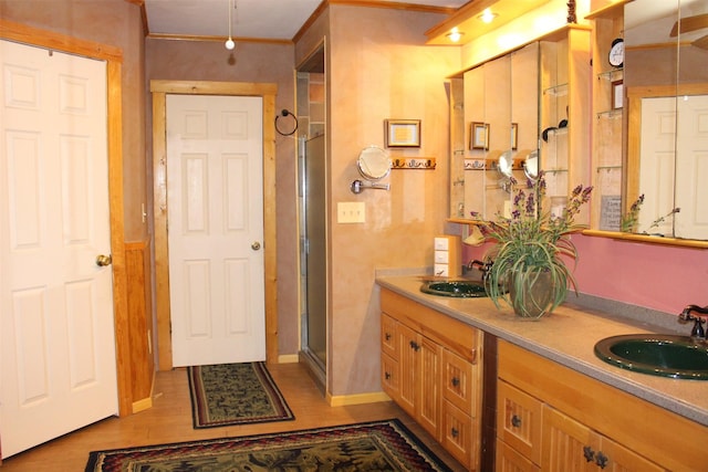 1147 Rs County Road 3503, Emory, TX 75440 - full bath featuring double vanity, a shower stall, wood finished floors, and baseboards