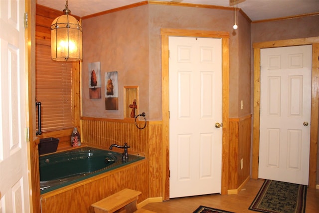 1147 Rs County Road 3503, Emory, TX 75440 - full bath featuring wood finished floors, wainscoting, ornamental molding, a bath, and wood walls