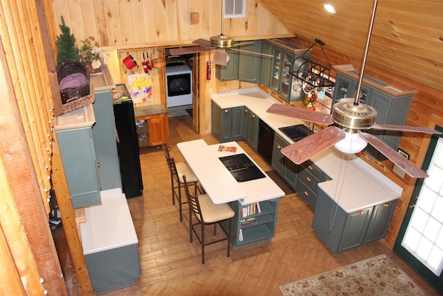 1147 Rs County Road 3503, Emory, TX 75440 - kitchen featuring a ceiling fan, light countertops, washer / dryer, and light wood finished floors