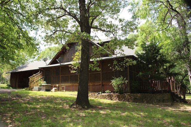 1147 Rs County Road 3503, Emory, TX 75440 - rear view of property with a sunroom, central AC unit, and a lawn