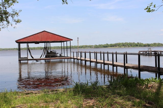 1147 Rs County Road 3503, Emory, TX 75440 - dock featuring boat lift and a water view