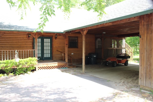 1147 Rs County Road 3503, Emory, TX 75440 - doorway to property featuring faux log siding, a shingled roof, a carport, and french doors
