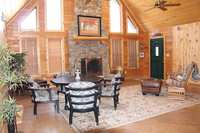 1147 Rs County Road 3503, Emory, TX 75440 - living area with high vaulted ceiling, wooden walls, healthy amount of natural light, ceiling fan, and wood finished floors