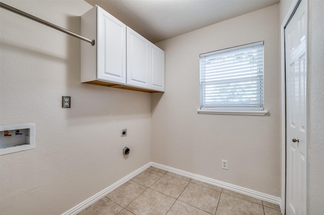 5072 Stanley Dr, The Colony, TX 75056 - washroom with hookup for a washing machine, electric dryer hookup, baseboards, and cabinet space